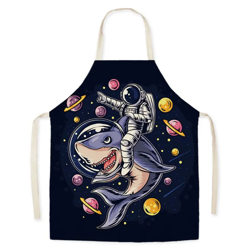 Kawaii apron with a space-themed design of a shark wearing an astronaut suit and planets.