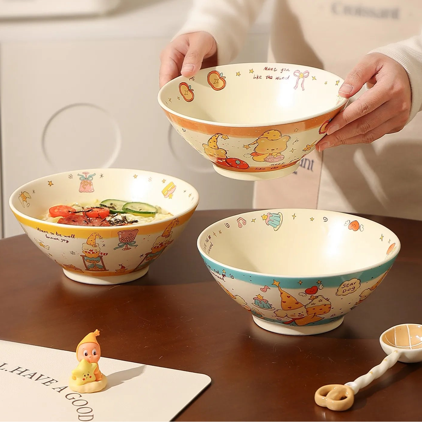 Three decorative kawaii ramen bowls on a table with text describing their versatility.