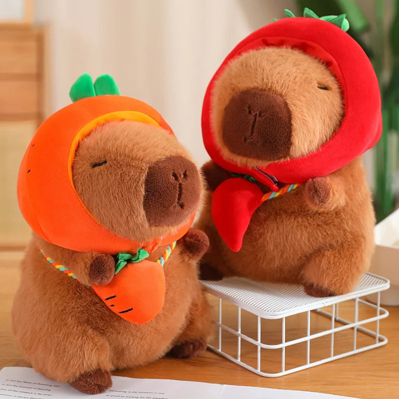 Two kawaii plush toys resembling bears in Halloween costumes on a wooden surface.