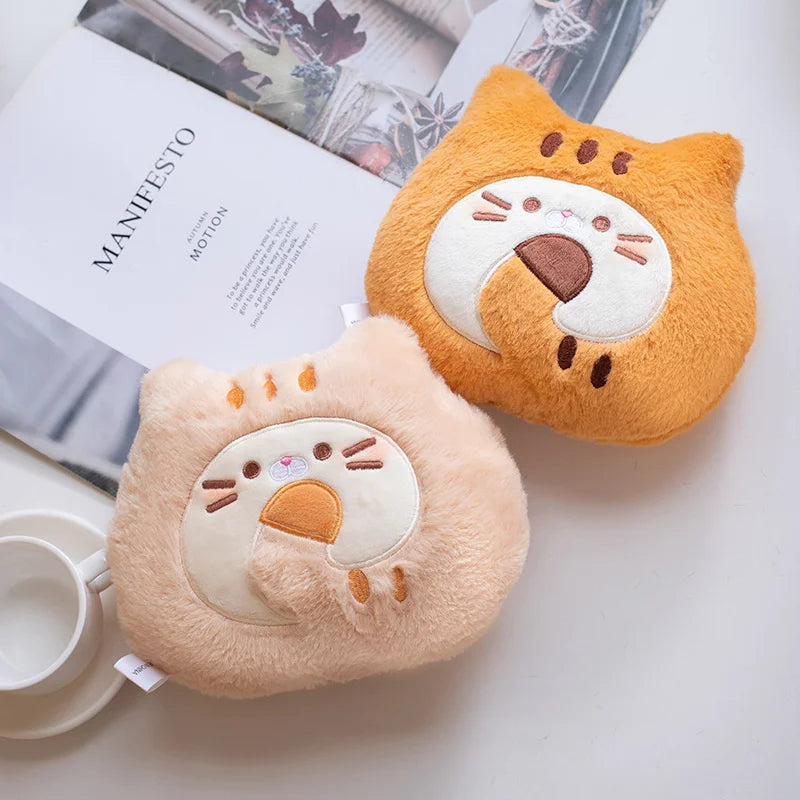 Two cute animal-shaped kawaii cushions on a surface with a book and mug in the background.