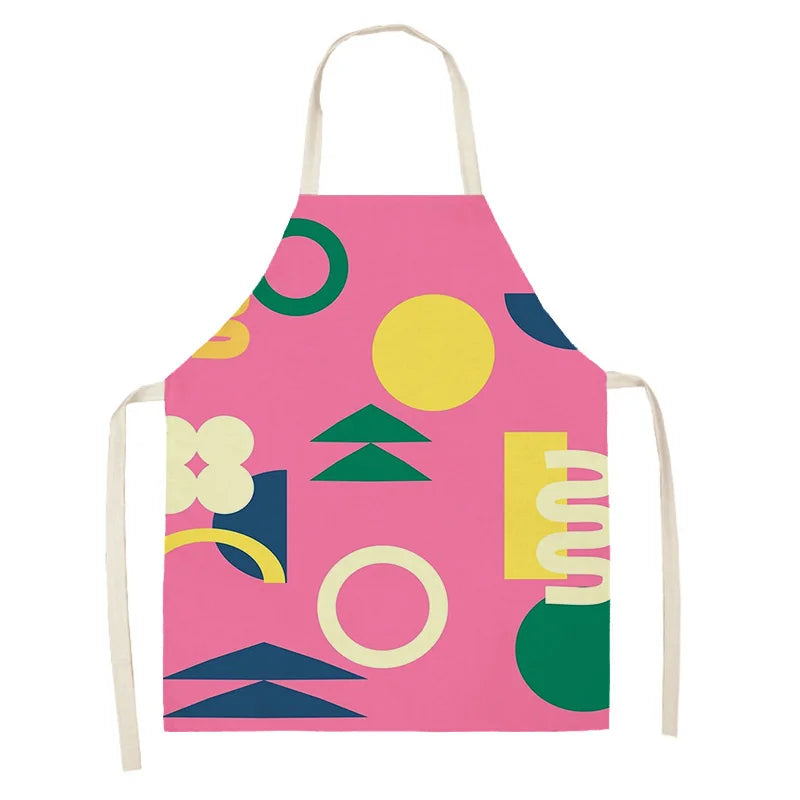 Colorful geometric patterned kawaii apron on a pink background