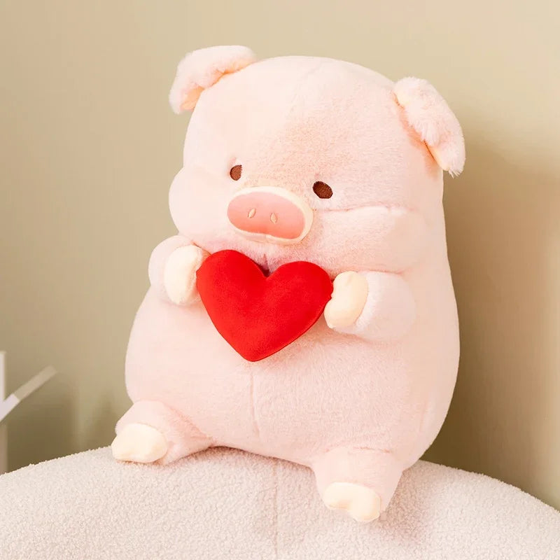 Kawaii plush pig toy holding a red heart against a neutral background