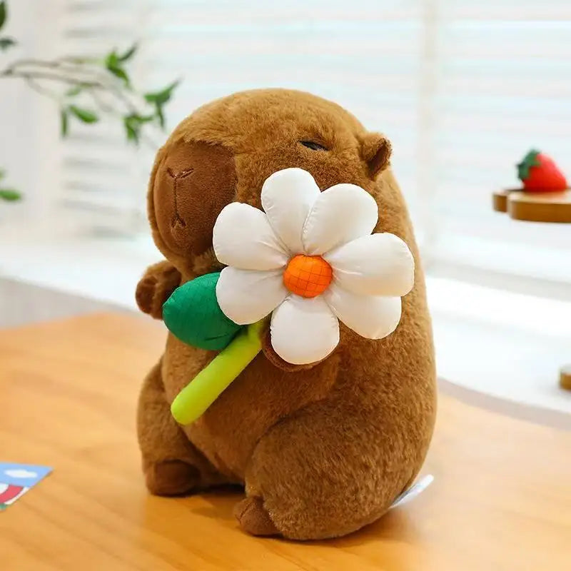 Kawaii plush toy otter holding a flower on a wooden surface