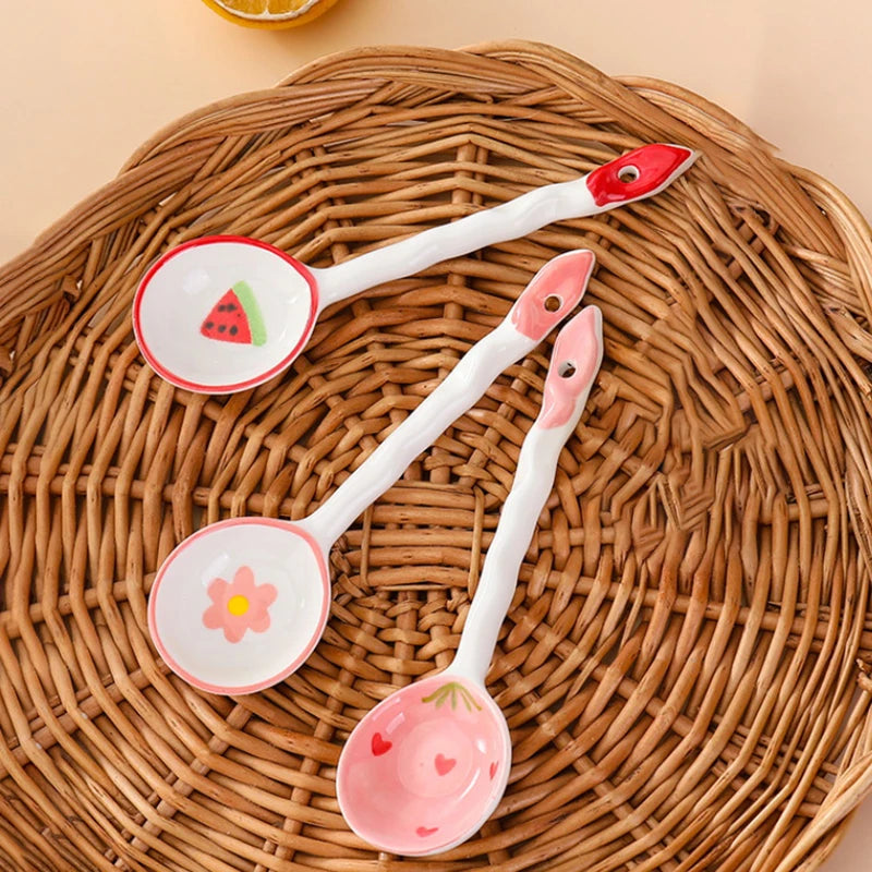 Three kawaii spoons on a woven wooden surface