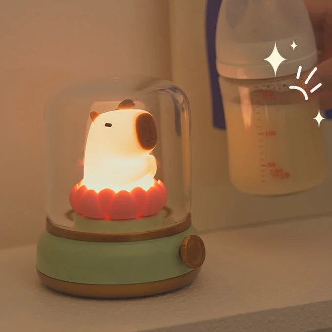 Cute kawaii animal-shaped night light with a baby bottle in the background