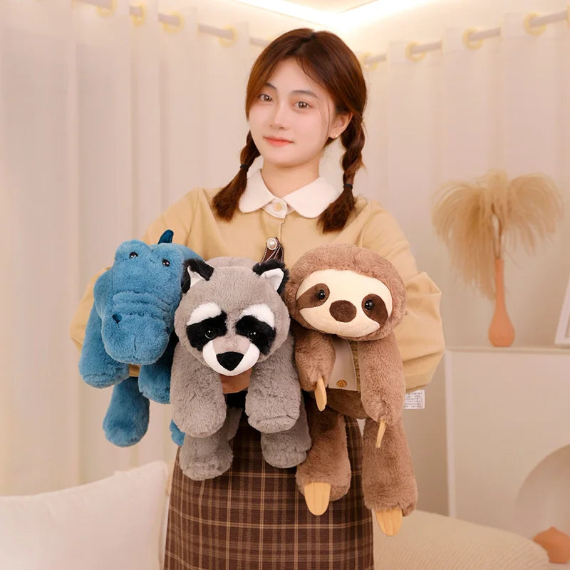 Person holding three kawaii plush toys in front of a neutral background