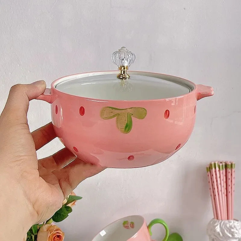 Someone holding a strawberry designed kawaii bowl
