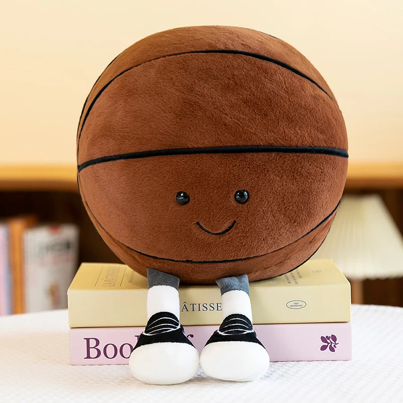 Kawaii plush toy basketball with legs and shoes on books against a neutral background