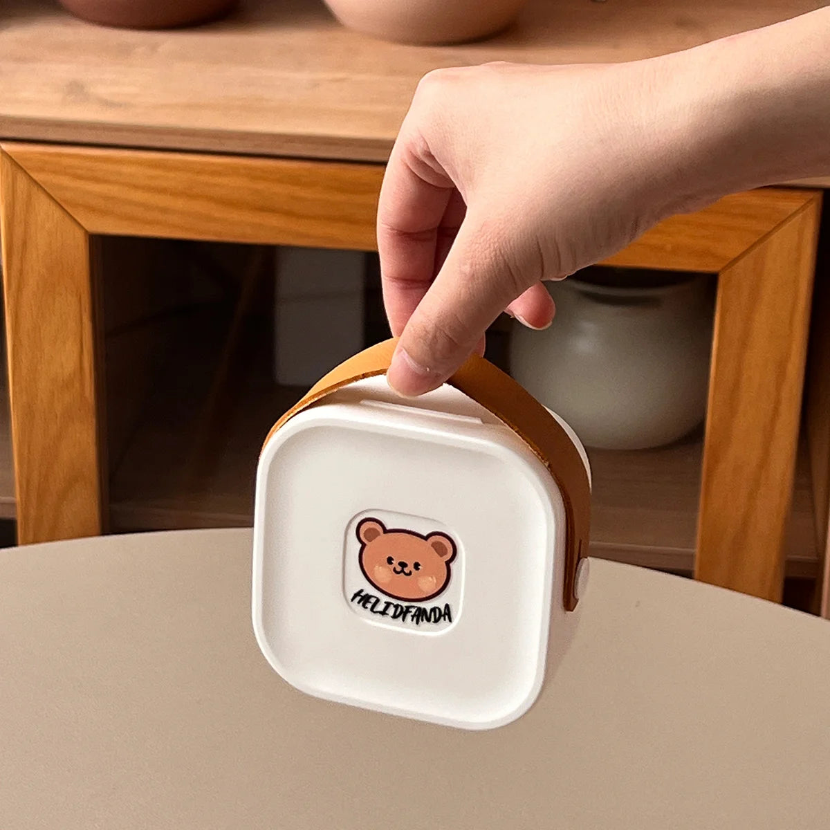 Someone holding a case of kawaii utensils