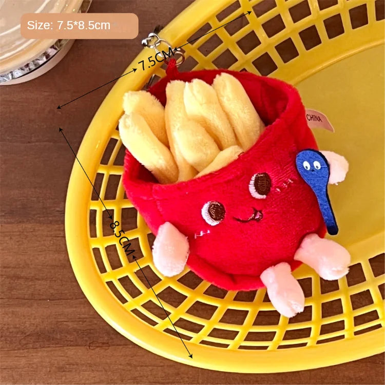 Red kawaii plush toy resembling a basket with fries on a yellow laundry basket