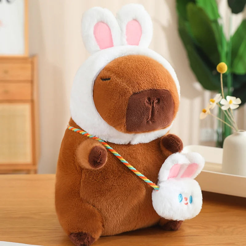Kawaii plush toy resembling a dog with bunny ears and tail on a wooden surface.