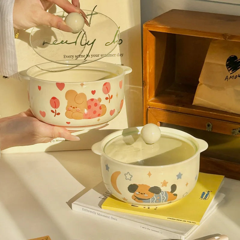 Ceramic kawaii ramen bowls with cartoon design on a surface with books and a wooden shelf in the background.