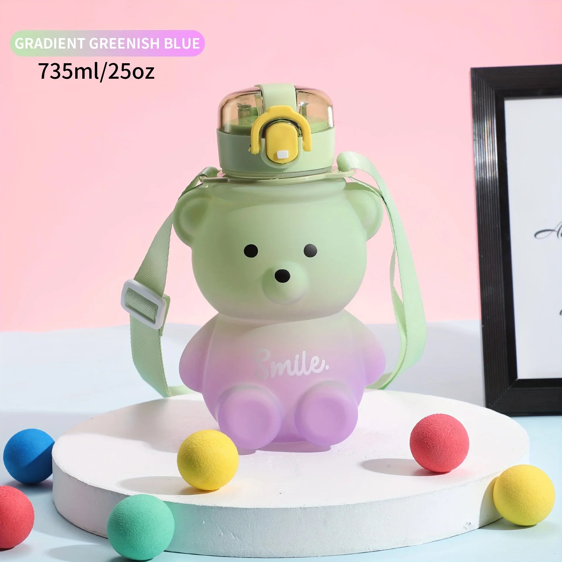 Gradient greenish blue kawaii water bottle shaped like a bear with colorful balls on a pink background
