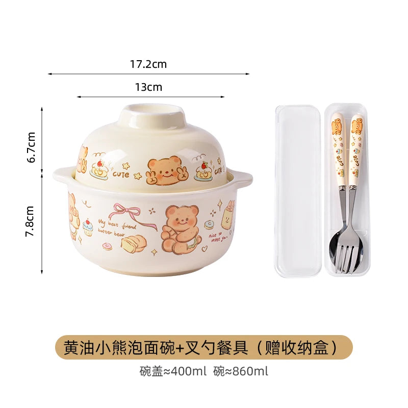 Ceramic kawaii ramen bowl with lid, fork, and spoon set on a white background