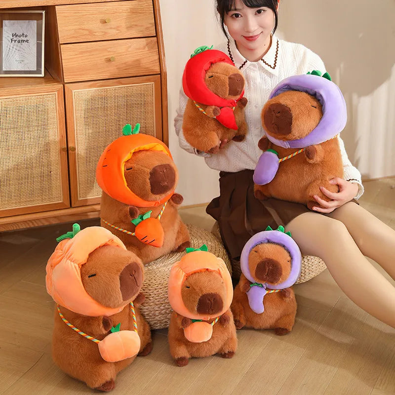 Person holding four brown kawaii plush toys with colorful hats on a wooden floor.
