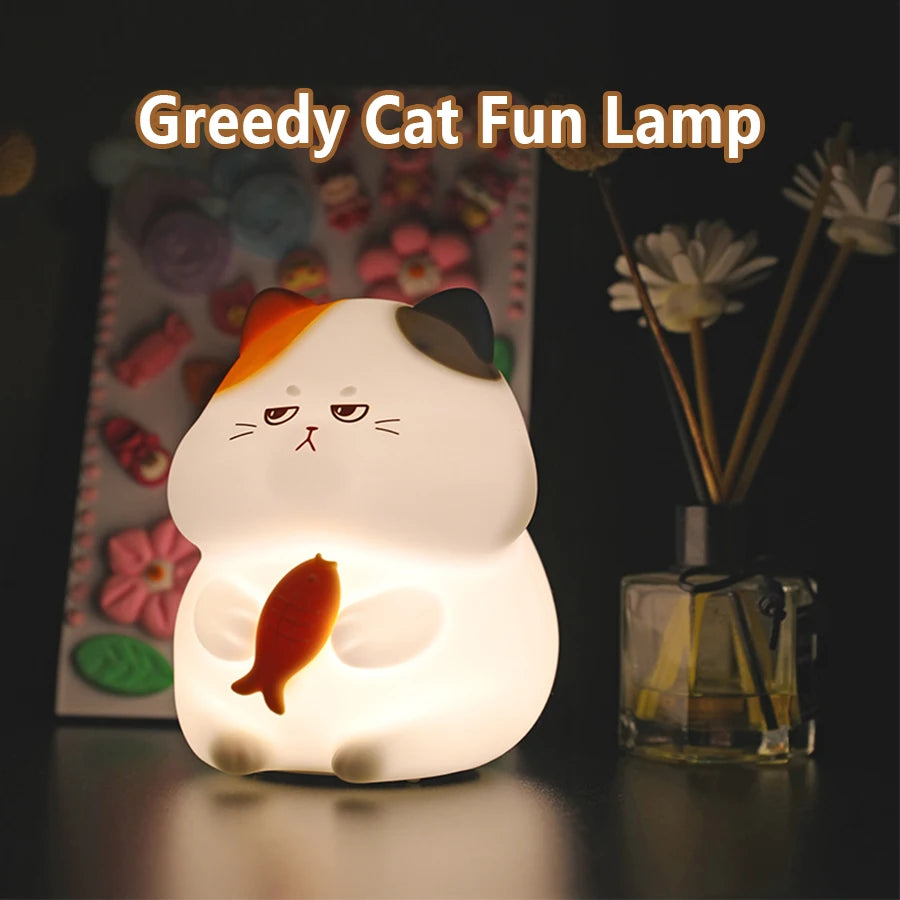 Cat-shaped kawaii lamp with a fish on a dark background