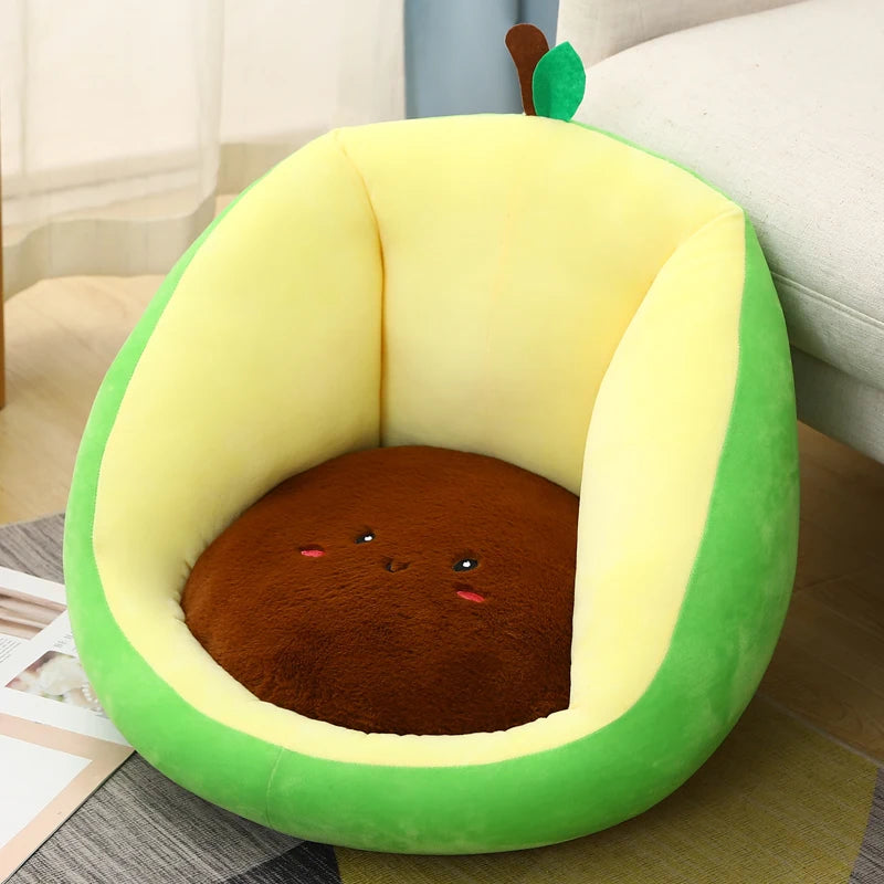 Avocado-shaped kawaii seat with a face on a wooden floor.