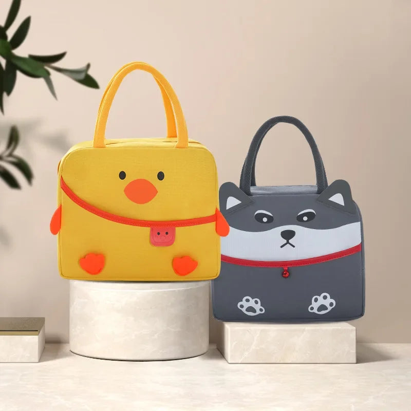 Yellow duck-shaped and gray dog-shaped kawaii bags on a neutral background