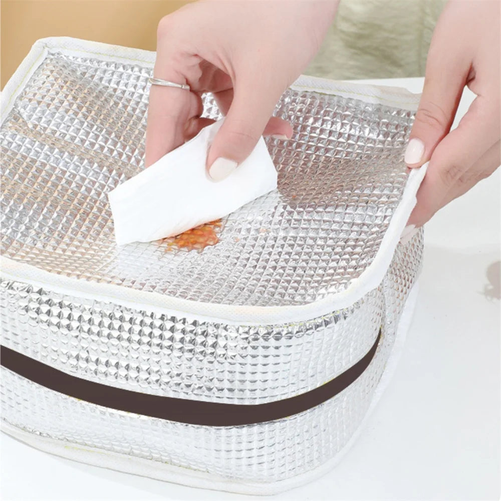 Person cleaning a mesh laundry kawaii bag with a white cloth.