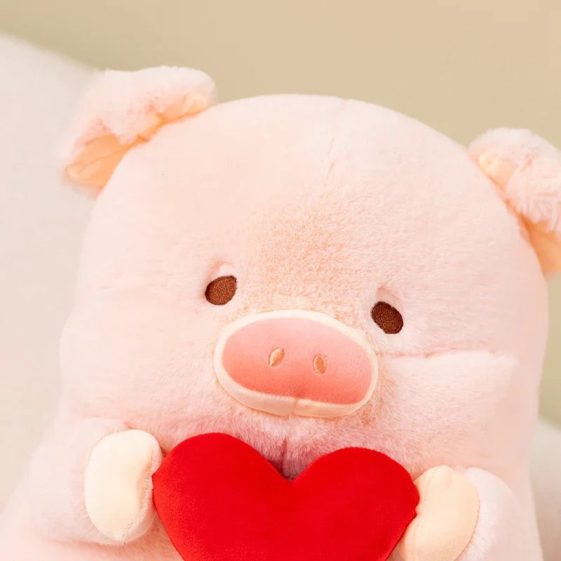 Kawaii plush pig toy holding a red heart against a light background