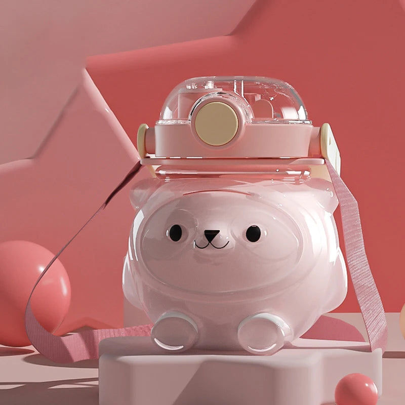 Pink bear-shaped kawaii water bottle with a transparent lid on a pink background