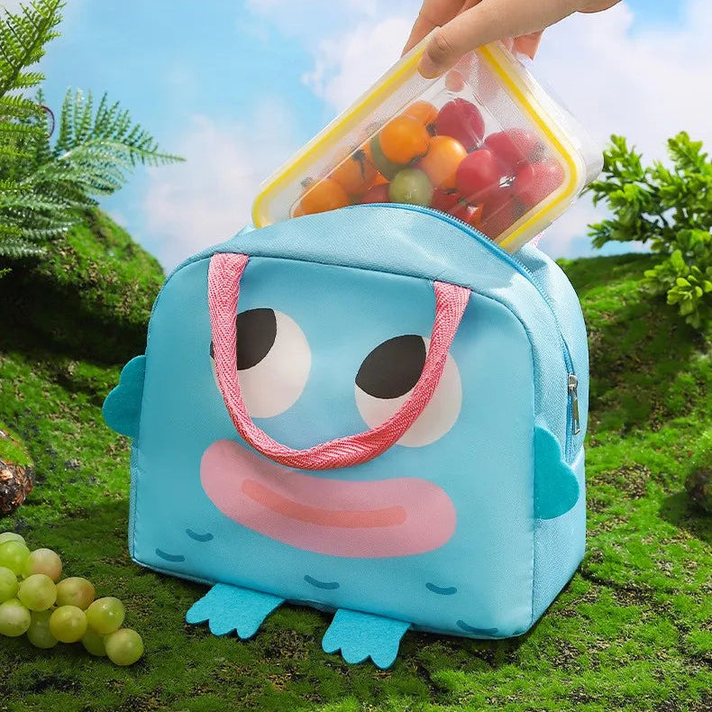 Blue kawaii lunch bag with cartoon design on grass with text about its features