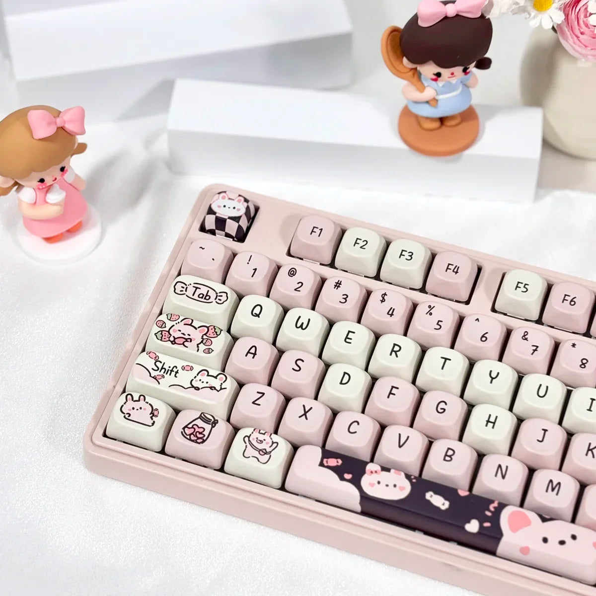 Keyboard with Kawaii keycaps on a white surface