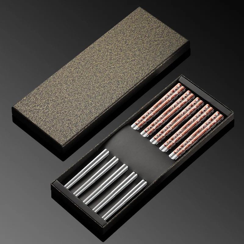 Set of kawaii chopsticks in a black box on a dark background