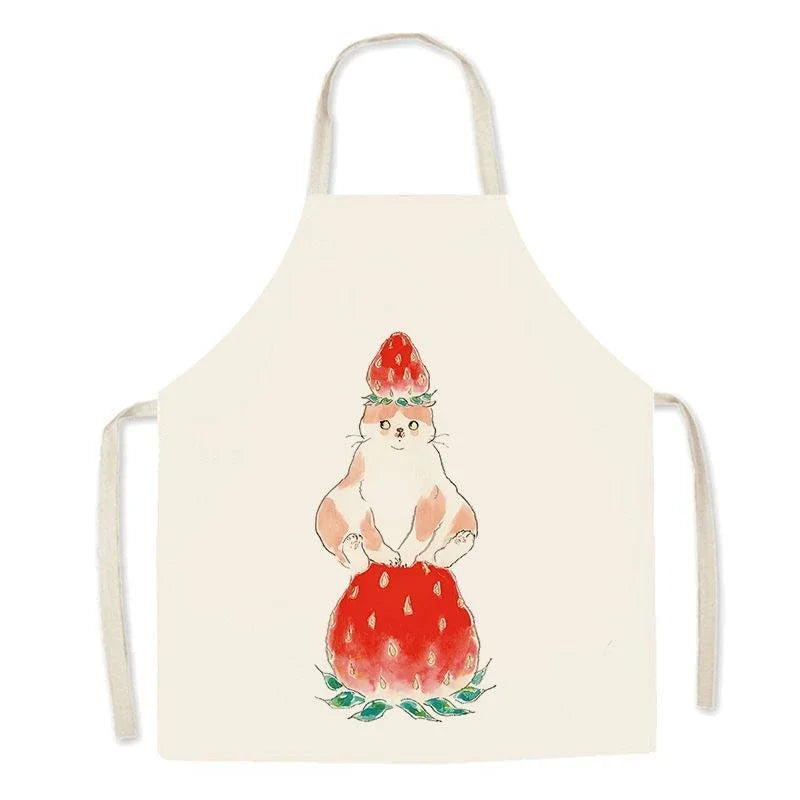 Kawaii apron with a cat sitting on a strawberry design on a white background