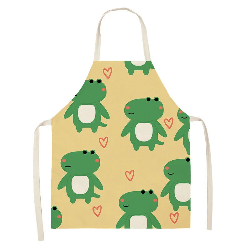 Children's kawaii apron with green frog pattern on a yellow background