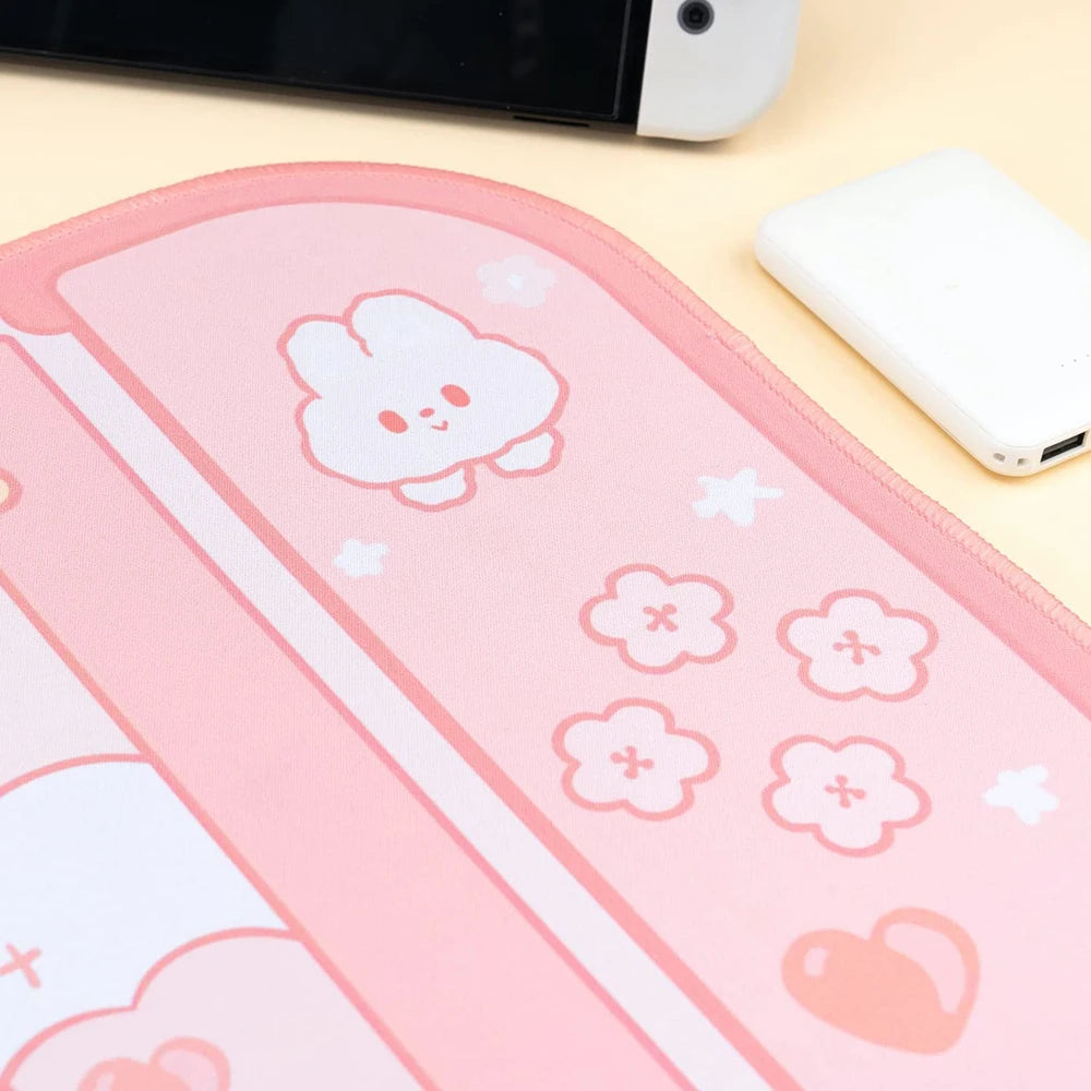 Pink pouch with Kawaii cartoon character and floral designs on a yellow surface