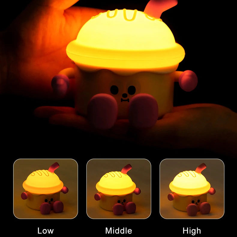 Kawaii night light with a light on a dark background, showing three brightness levels.