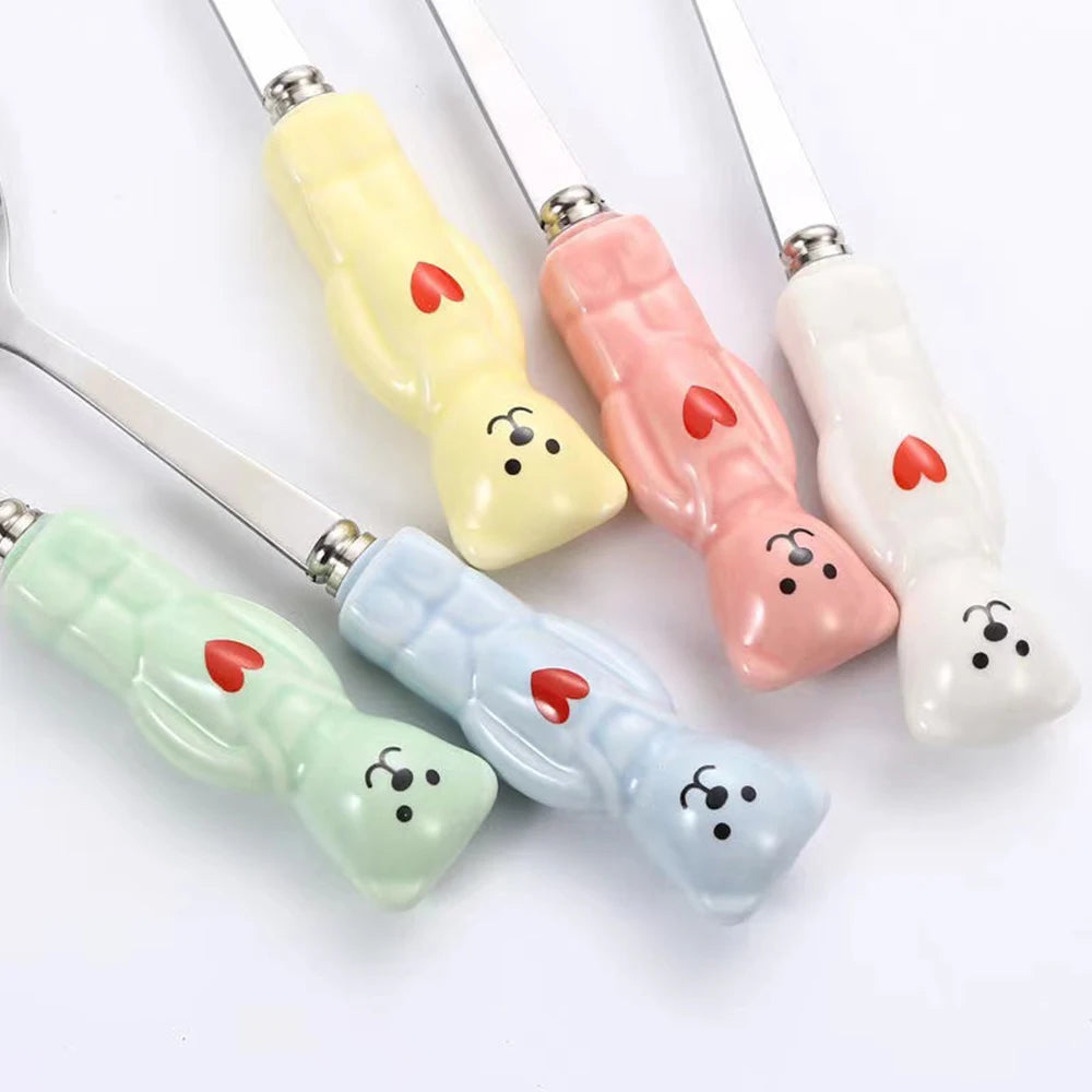 Set of colorful kawaii utensils with cartoonish designs on a white background