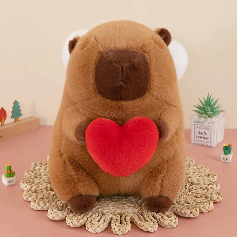 Kawaii plush animal toy with a red heart on a decorative mat