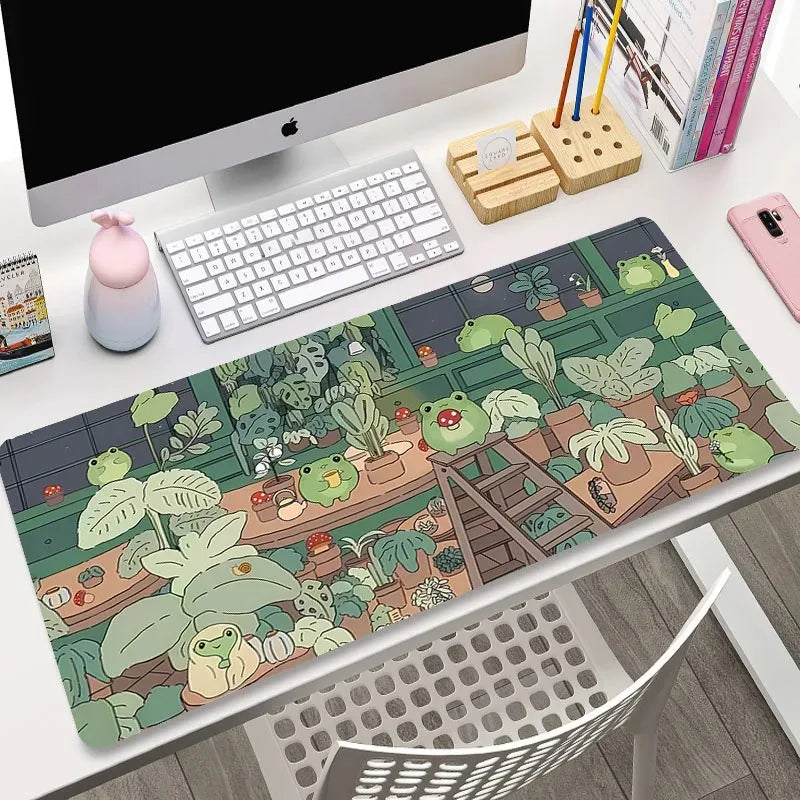 Desk setup with a Kawaii frog-themed mouse pad, keyboard, and office items.