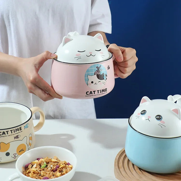 A person holding a pink cat themed kawaii ramen bowl