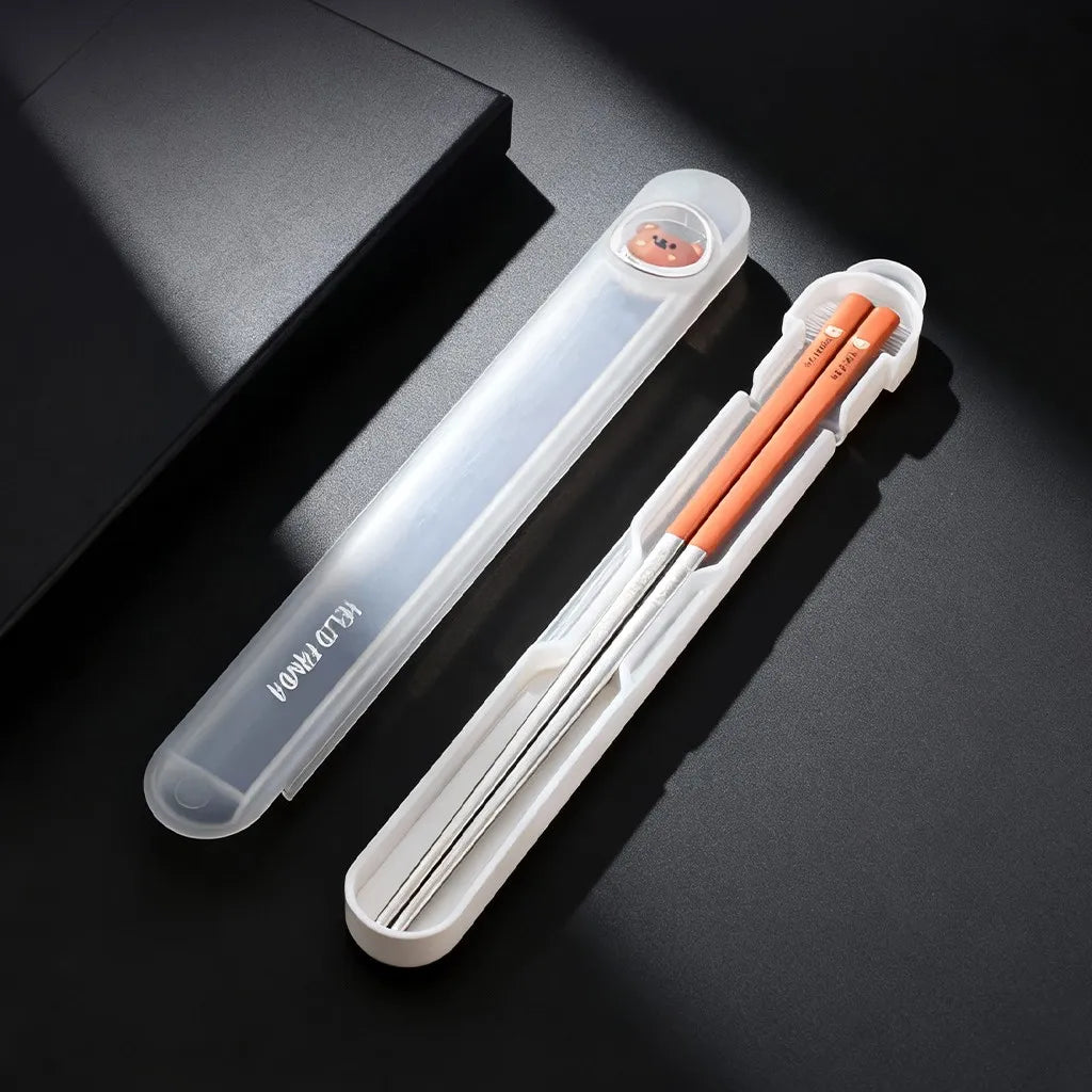 Set of kawaii chopsticks in a clear case on a dark surface