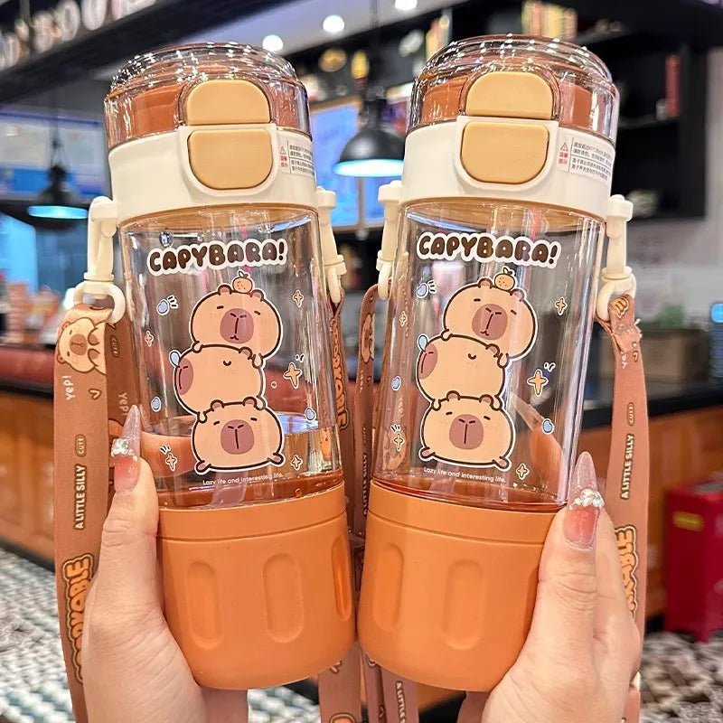 Two kawaii water bottles held by a person in a casual setting.