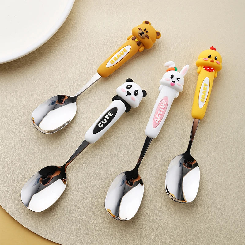A group of four animal shaped kawaii spoons on a kitchen table