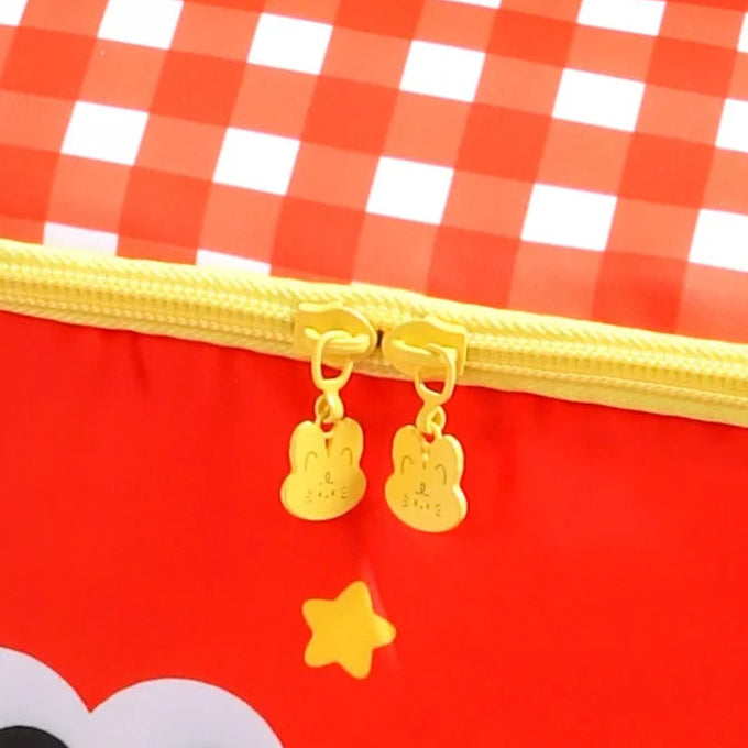 Red checkered kawaii lunch bag with gold zipper and decorative elements on a white background