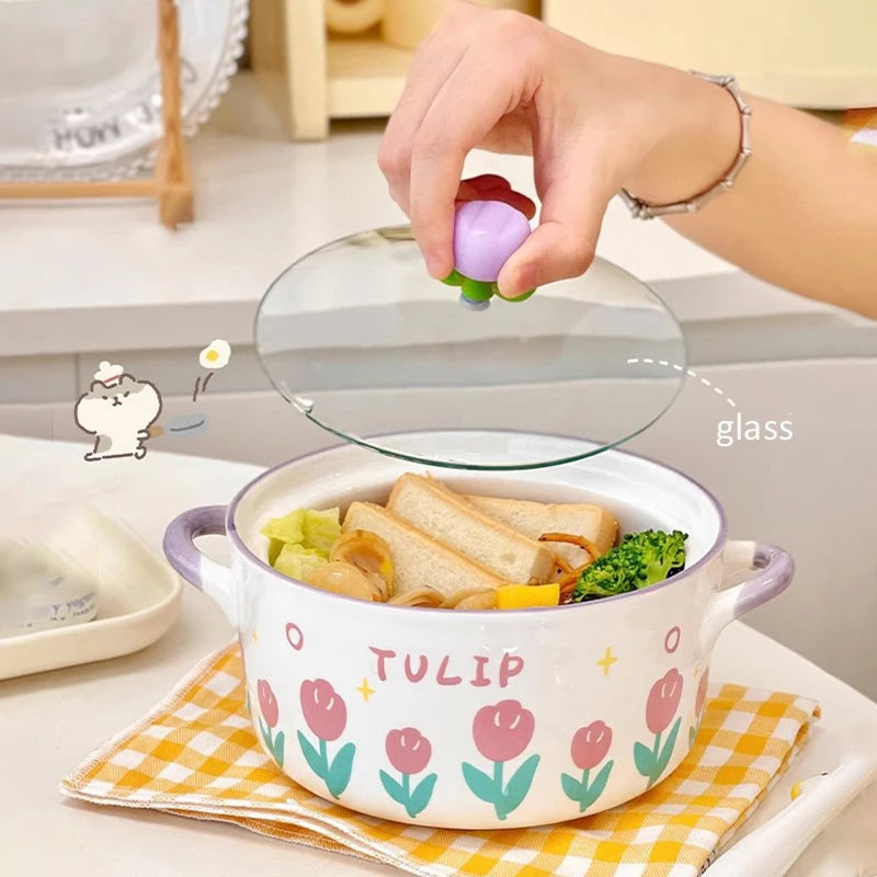 Ceramic kawaii ramen bowls with tulip design on a checkered cloth, glass lid being held above it.