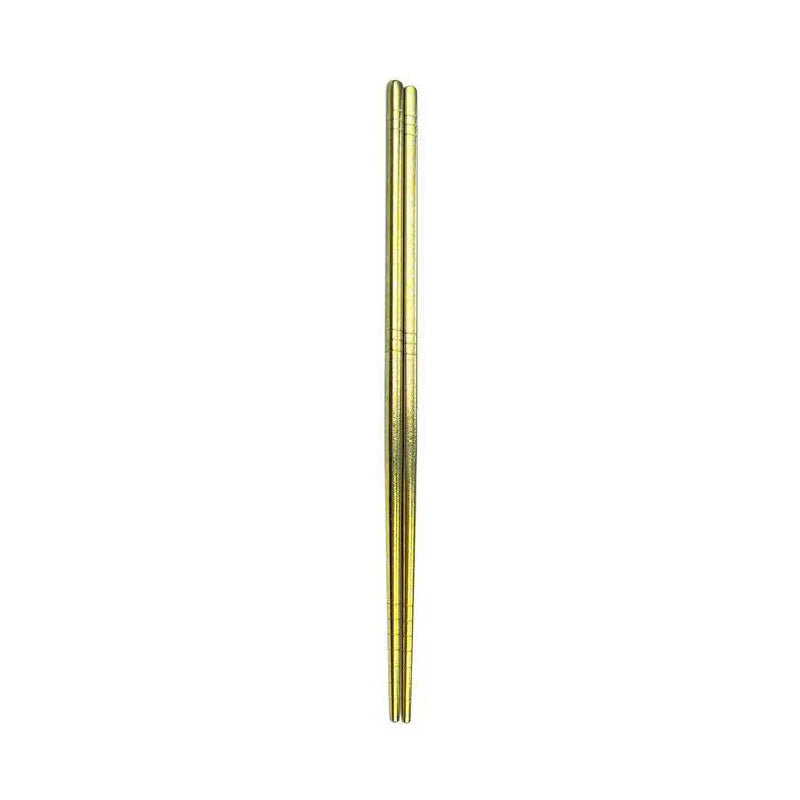 Gold kawaii chopsticks on a white background