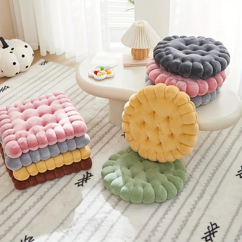 Colorful textured kawaii cushions on a white surface with a soft focus background