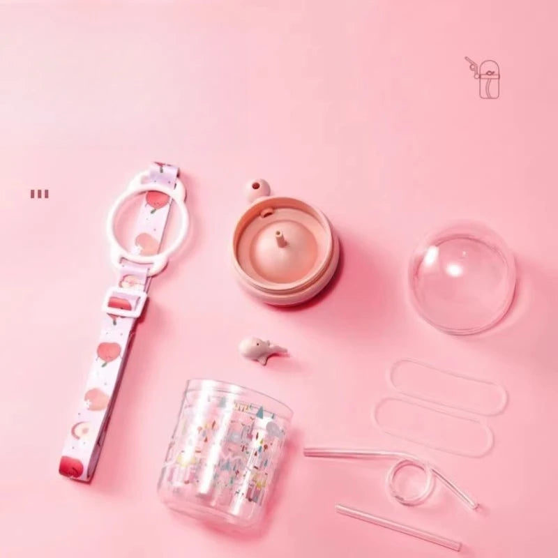 Pink-themed kawaii bottle, cup, and accessories on a pink background