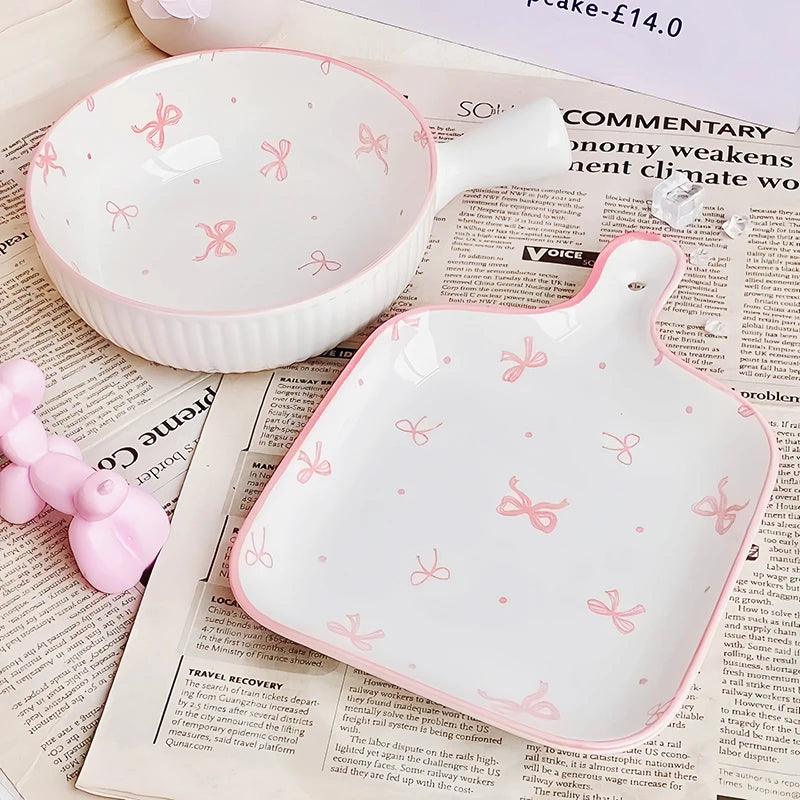 White kawaii ramen bowl with pink bows on a newspaper background