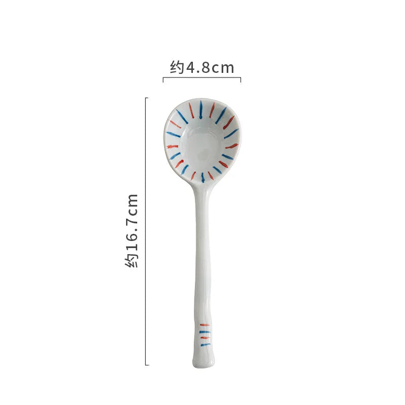 White kawaii spoon with colorful design on a white background, showing measurements.