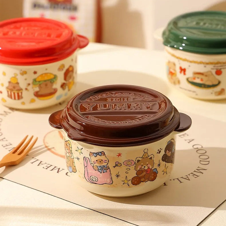 Ceramic kawaii ramen bowl with cartoon designs and a brown lid on a white surface.