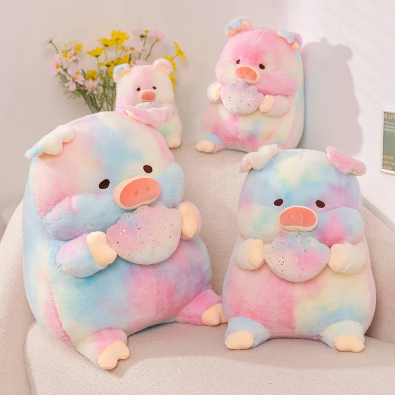 Four rainbow pig kawaii plush toys of various sizes on a chair