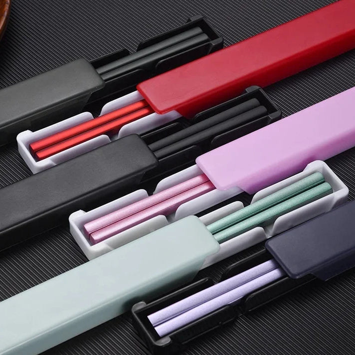 Set of colorful kawaii chopsticks on a dark textured surface