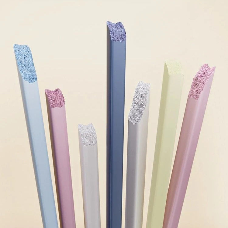Set of colorful kawaii chopsticks with decorative tips on a beige background